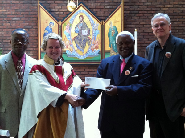 Receiving the check from St. John's in the Village
